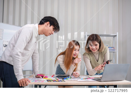 Creative designer team meeting on application design and ux ui usability planning. business team teamwork. 122717995