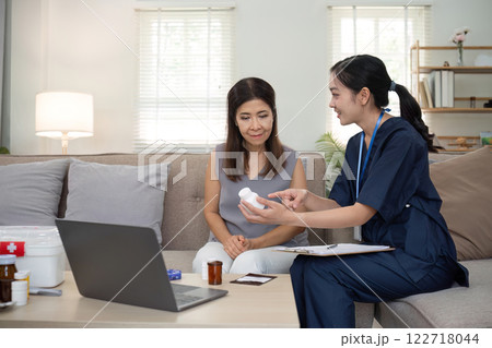 A beautiful female elderly caregiver helps and gives advice. Health care and health check-up for elderly women aged 60 years 122718044