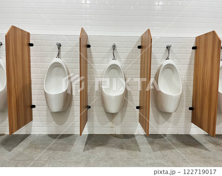 White ceramic urinal, modern bathroom interior, Public toilet men toilet bowl, Oval ceramic urinal. Public place White ceramic urinal, modern bathroom interior, Public toilet men toilet bowl, Oval ceramic urinal. Public place 122719017