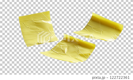 a image of three yellow sticky notes arranged on a plain background. The notes appear slightly crumpled and have a realistic texture 122722361