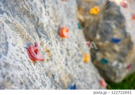 Close up view of a short rock climbing wall on the playground, concept of developing strength and coordination of children 122722691