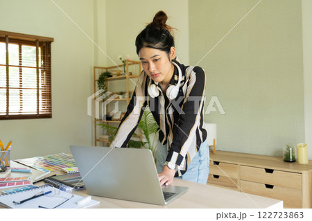 Young designer working on color palette. Young designer working on color palette. 122723863