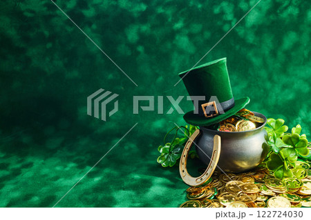 St. Patrick's Day Treasures. Green hat with gold coins, lucky clovers, and a pot St. Patrick's Day Treasures. Green hat with gold coins, lucky clovers, and a pot 122724030