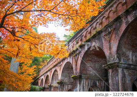 Nanzenji Temple brick aqueduct landmark with autumn leaf, Kyoto 122724676