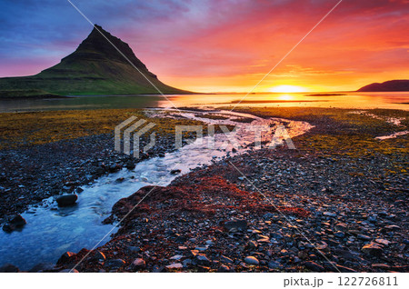 The picturesque sunset over landscapes and waterfalls. Kirkjufell mountain,Iceland 122726811