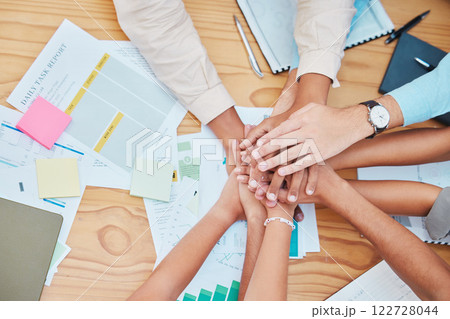 Team hands collaboration for success, celebration and support on a table in a office. Business teamwork and motivation to achieve a goal together during team building mission in a startup company Team hands collaboration for success, celebration and support on a table in a office. Business teamwork and motivation to achieve a goal together during team building mission in a startup company 122728044