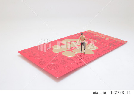 Miniature Figure Standing on Red Envelope with Gold Oriental Miniature Figure Standing on Red Envelope with Gold Oriental 122728116