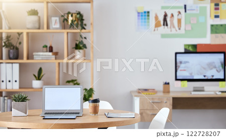 Empty business office interior with a laptop and computer on a desk or table with a professional design. An agency workspace or workplace with equipment connected to the internet or company wifi Empty business office interior with a laptop and computer on a desk or table with a professional design. An agency workspace or workplace with equipment connected to the internet or company wifi 122728207