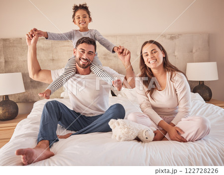 Fun family portrait, parents or girl playing in home bedroom for man, woman or girl in happy family. Smile, love or relax couple, bonding mother or father carrying child on shoulder in house interior Fun family portrait, parents or girl playing in home bedroom for man, woman or girl in happy family. Smile, love or relax couple, bonding mother or father carrying child on shoulder in house interior 122728226