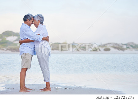 Senior couple retirement, beach holiday and travel vacation at sea with hug, love and care together. Elderly people in happy marriage, intimate hug and romantic relationship relax at ocean outdoor 122728278