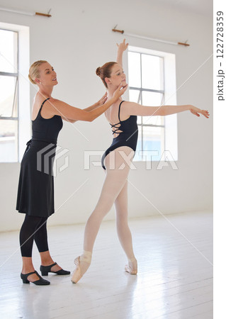 Coach training a ballet dancer in studio, girl learning a dance performance with teacher in class and woman teaching creative dancing in room. Happy ballerina with smile in uniform at school Coach training a ballet dancer in studio, girl learning a dance performance with teacher in class and woman teaching creative dancing in room. Happy ballerina with smile in uniform at school 122728359