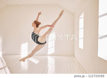 Ballet, jump and performance dance studio with young student. Dancer girl with energy in isolated classroom and moving in the air. Beautiful woman ballerina with strong body and stunning posture. 122728389
