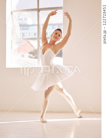 Dance, ballet and studio with a woman dancer training, practicing or dancing for a performance, recital or rehearsal. Artistic, perform or technique with a young female in a school for production art 122728451