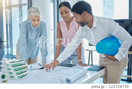 Design, construction and an architect in an office with blueprints, a city planning and strategy meeting. Architecture, engineering and apartment building plans, teamwork and communication at work. 122728730
