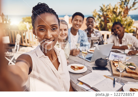 Brunch, selfie and friends at a beach restaurant after successful teamwork and business collaboration. Wine, champagne glasses on lunch table and happy global marketing group celebrate in luxury Brunch, selfie and friends at a beach restaurant after successful teamwork and business collaboration. Wine, champagne glasses on lunch table and happy global marketing group celebrate in luxury 122728857