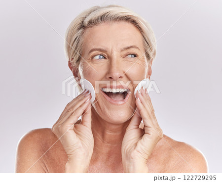 Senior woman skincare and face with product remover and makeup cleaning or beauty model with cosmetic cotton pads on studio mockup background. Happy woman face, headshot and wrinkles or skin care 122729295
