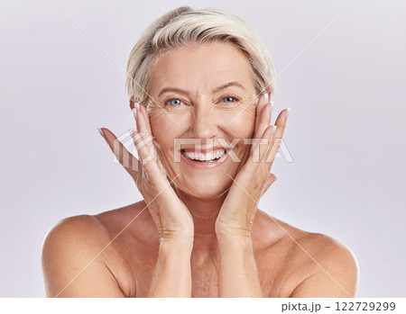 Portrait of a woman happy face smile with healthy skincare while posing in a studio against purple mockup studio background. Elderly woman doing her wellness skin cosmetic treatment routine 122729299