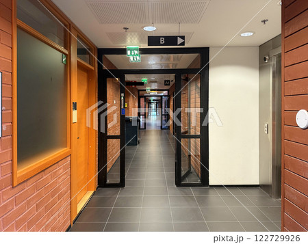 Empty long corridor in modern building, hall background 122729926