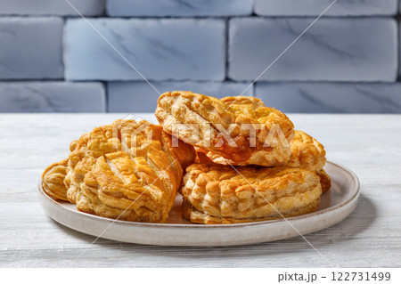 puff pastry apple turnovers on a plate puff pastry apple turnovers on a plate 122731499