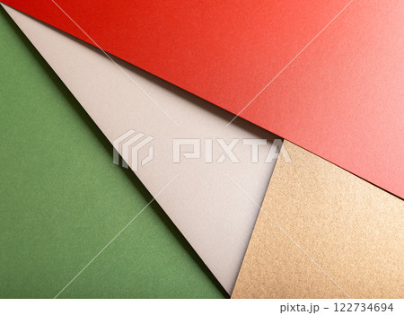 Festive wrapping paper with a textured surface in red, green, and gold. Elegant and decorative Festive wrapping paper with a textured surface in red, green, and gold. Elegant and decorative 122734694