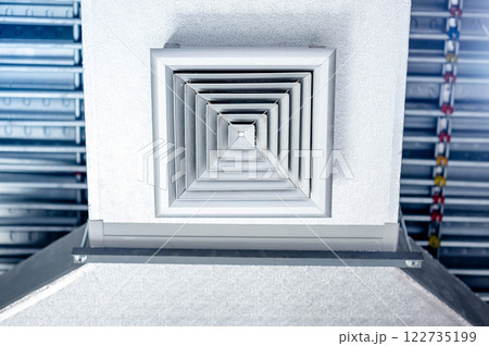 Air vent duct with metallic grill installed on the ceiling 122735199