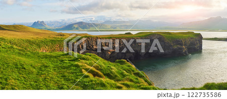 Cape Dyrholaey at southern Iceland. Altitude 120 m, and mean hill island with a door opening 122735586