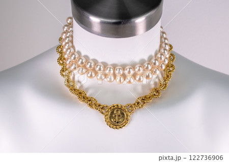 Unique necklace on a white mannequin, promotional photo for an online vintage and handmade jewelry store Unique necklace on a white mannequin, promotional photo for an online vintage and handmade jewelry store 122736906