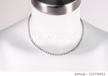Unique necklace on a white mannequin, promotional photo for an online vintage and handmade jewelry store 122736912