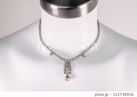 Unique necklace on a white mannequin, promotional photo for an online vintage and handmade jewelry store 122736916