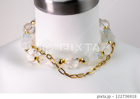 Unique necklace on a white mannequin, promotional photo for an online vintage and handmade jewelry store Unique necklace on a white mannequin, promotional photo for an online vintage and handmade jewelry store 122736918