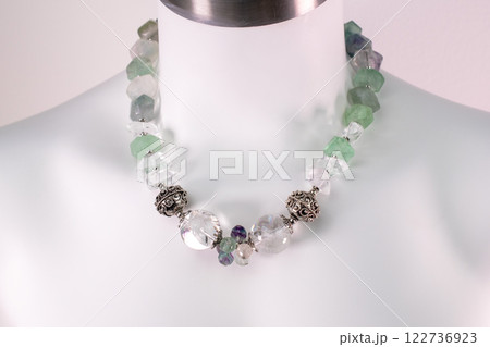 Unique necklace on a white mannequin, promotional photo for an online vintage and handmade jewelry store 122736923