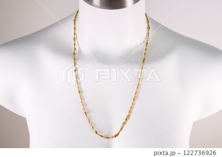Unique necklace on a white mannequin, promotional photo for an online vintage and handmade jewelry store Unique necklace on a white mannequin, promotional photo for an online vintage and handmade jewelry store 122736926