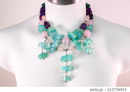 Unique necklace on a white mannequin, promotional photo for an online vintage and handmade jewelry store 122736931
