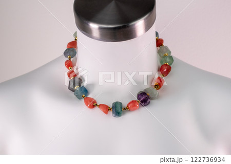 Unique necklace on a white mannequin, promotional photo for an online vintage and handmade jewelry store 122736934