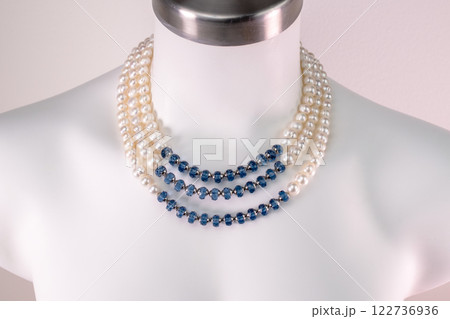Unique necklace on a white mannequin, promotional photo for an online vintage and handmade jewelry store Unique necklace on a white mannequin, promotional photo for an online vintage and handmade jewelry store 122736936