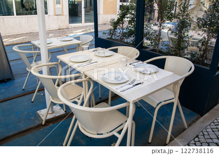 Empty cafe tables on the veranda of the restaurant Empty cafe tables on the veranda of the restaurant 122738116