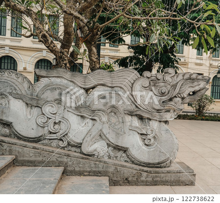 An Intricate Stone Dragon Sculpture is beautifully situated within a Historic Park setting An Intricate Stone Dragon Sculpture is beautifully situated within a Historic Park setting 122738622