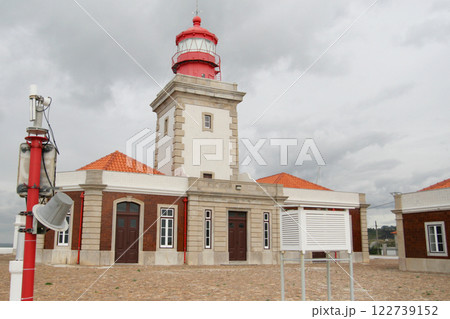 Beautiful old lighthouse against blue sky, Cape Da Roca, Cabo da Roca, Portugal 122739152