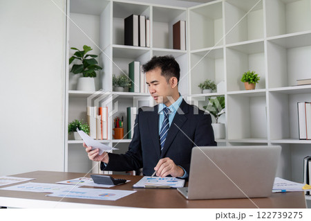 Financial Consultant Analyzing Corporate Data for Business Development Financial Consultant Analyzing Corporate Data for Business Development 122739275