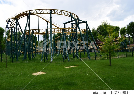 Kharkov, Ukraine, 14 May 2024. A roller coaster of metal structure with yellow rails and dark green support. Adrenaline Rush Ride Kharkov, Ukraine, 14 May 2024. A roller coaster of metal structure with yellow rails and dark green support. Adrenaline Rush Ride 122739832