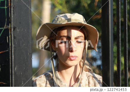 Young Woman Soldier Escaping From Prison 122741453