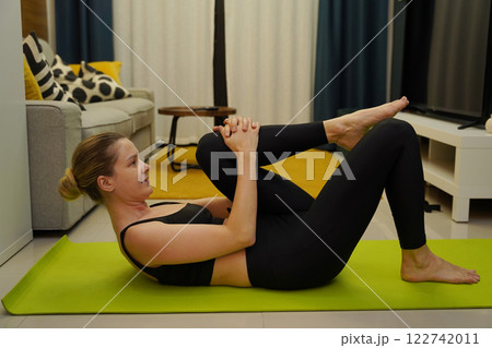 A young woman have a joyfully yoga practice  122742011