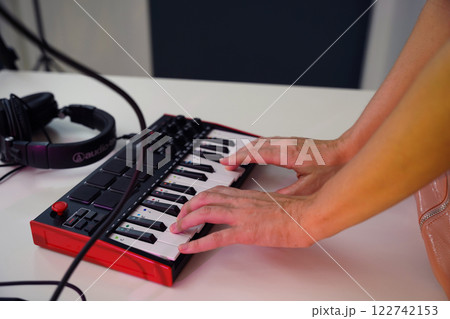 Beautiful young singer and musician broadcast from her home studio Beautiful young singer and musician broadcast from her home studio 122742153