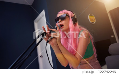 Beautiful young singer and musician broadcast from her home studio Beautiful young singer and musician broadcast from her home studio 122742243