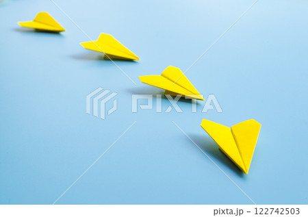 View of origami yellow paper airplane from vision to reality with the flight of leadership View of origami yellow paper airplane from vision to reality with the flight of leadership 122742503
