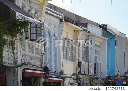 Detailed view of windows, doors and balconies of city buildings  122742818