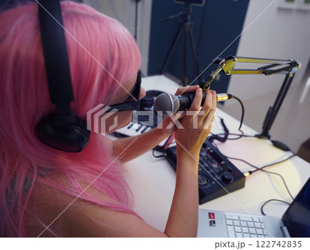 Beautiful young singer and musician broadcast from her home studio Beautiful young singer and musician broadcast from her home studio 122742835