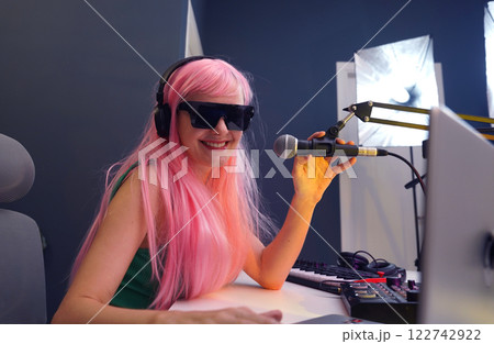 Beautiful young singer and musician broadcast from her home studio Beautiful young singer and musician broadcast from her home studio 122742922