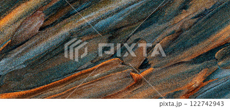 Vibrant Abstract Texture with Blue, Golden and Brown Streaks Blending in Shimmering Pattern 122742943