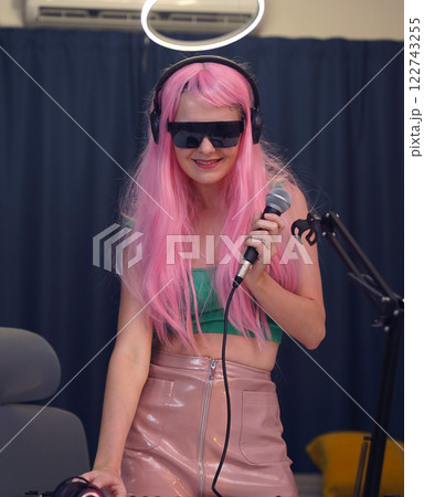 Beautiful young singer and musician broadcast from her home studio 122743255